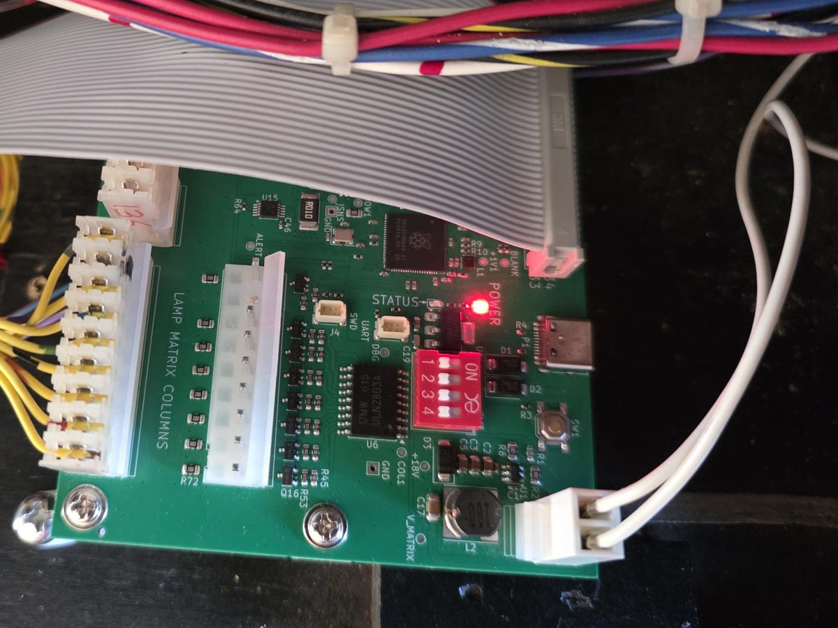 Aurora Matrix LED lamp matrix board fitted in a WPC backbox, with the ribbon cable and lamp column connectors plugged in